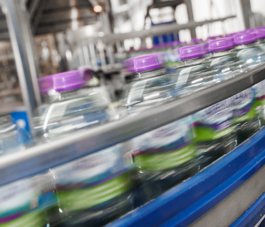 Highland Spring Still Water Bottles on a Conveyor Belt.